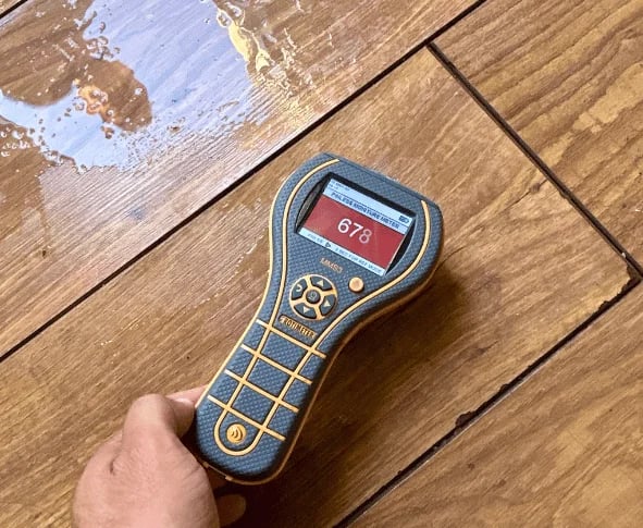 moistuture meter on flooded floor